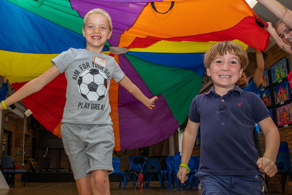 2 boys children parachute game